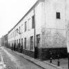 Arbeiderswoningen in de Benedictijnenstraat met ingang naar een beluik. Hier verrijst in 1960 Home Fabiola (Collectie Universiteitsarchief Gent).